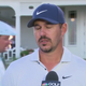 Brooks Koepka rolls his eyes SUPER HARD as Bryson DeChambeau walks behind him mid-interview.